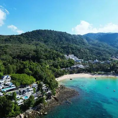 an aerial view of a beach with houses and trees at Villa Nevaeh - Ocean Front Private Villa Kamala Beach in Phuket Town