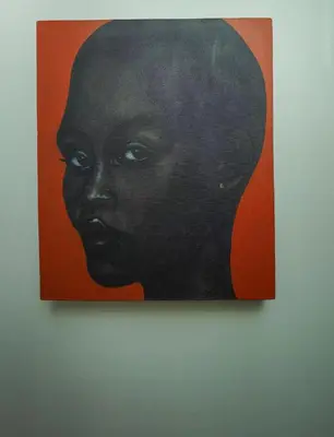 a painting of a black woman on a wall at Bluepoint SeaView Retreat Patong in Patong Beach