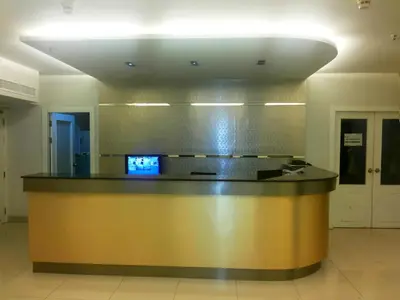 a large lobby with a reception desk in a building at Patong Tower by United 21 Thailand in Patong Beach