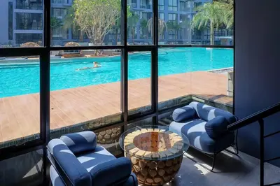 a view of a pool from a hotel room at Kamala Beach P73 Exclusive Junior Suite in Kamala Beach