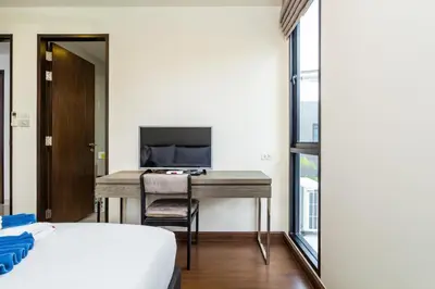 a bedroom with a desk and a bed and a television at Phuket villa in Laguna Park in Bang Tao Beach