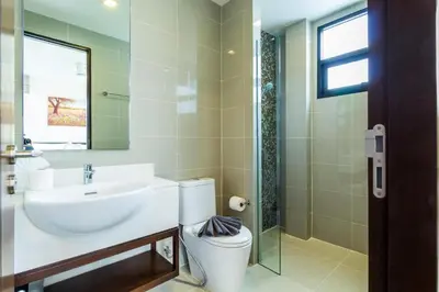 a bathroom with a sink and a toilet and a mirror at Phuket villa in Laguna Park in Bang Tao Beach
