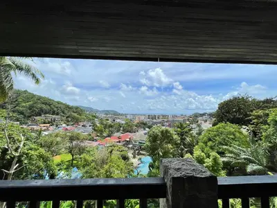 a view of a city from a balcony at Boomerang Village Resort Kata in Kata Beach
