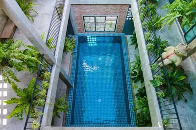 an overhead view of a swimming pool at a resort at 9BR Neverland Loft Pool Villa in Ban Saiyuan (1)
