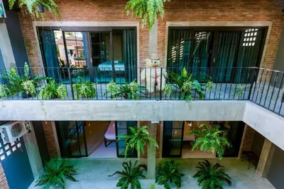 an overhead view of a building with plants on a balcony at 9BR Neverland Loft Pool Villa in Ban Saiyuan (1)