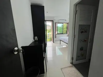 a hallway with a door leading to a bedroom at Patong Easy Life 6 in Patong Beach