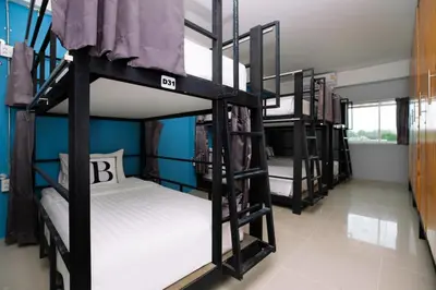 a group of bunk beds in a room at Bell Lifestyle Hostel Phuket in Nai Yang Beach