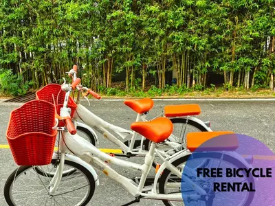 two bikes parked on the side of the road at Bell Lifestyle Hostel Phuket in Nai Yang Beach