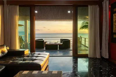 a living room with a view of the ocean at Villa Serenity pool SeaView 6BR in Kamala Beach