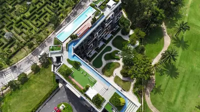 an overhead view of a building with a swimming pool at 1 Bedroom Sky Park corner in Bang Tao Beach