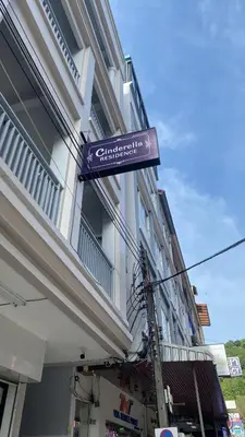 a sign on the side of a building at Cinderella Residence in Patong Beach