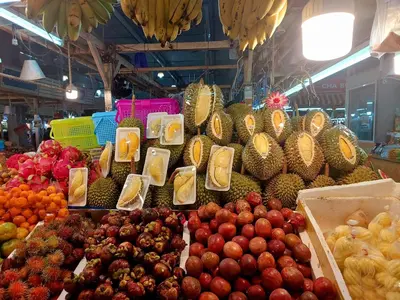 a display of fruits and vegetables in a market at Cinderella Residence in Patong Beach