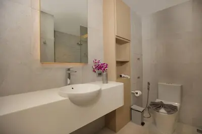 a bathroom with a sink and a toilet at Chic Design & Full Seaview 2BR Karon Condo 16C, near Beach in Karon Beach