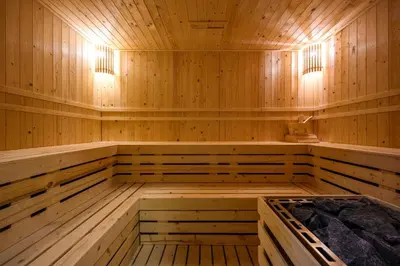an empty sauna with wooden walls and ceilings at Deluxe apartment with sea view and jacuzzi in Surin Beach