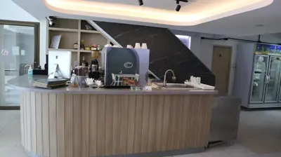 a kitchen with a counter with a computer on it at Patong Triple P in Patong Beach