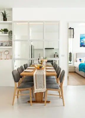 a dining room with a wooden table and chairs at Kamala Garden View Villa 3 Bdr in Kamala Beach