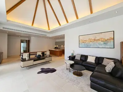 a living room with a couch and a table at Private pool villa 3 Bed, 3 Bath near airport in Phuket Town
