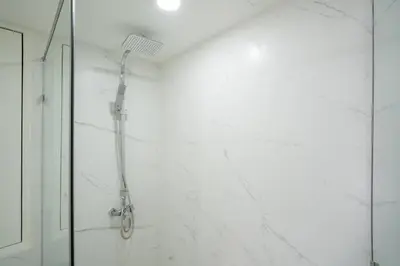 a shower in a bathroom with a glass door at Patong Tower Brand New 1-Bedroom , Near Beach in Patong Beach