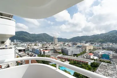 a view of a city from the balcony of a ship at Patong Tower 1-Bedroom , 200 meters from the Beach in Patong Beach
