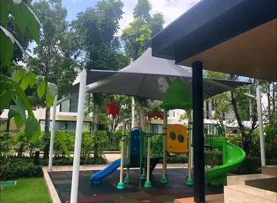 a playground with a slide and an umbrella at 3BDR Townhouse in Laguna Park in Bang Tao Beach
