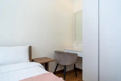 a bedroom with a bed and a desk and a chair at 3BDR Townhouse in Laguna Park in Bang Tao Beach