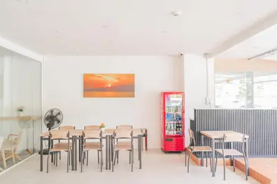 a dining room with a table and chairs at Patong Diamond Hotel in Patong Beach