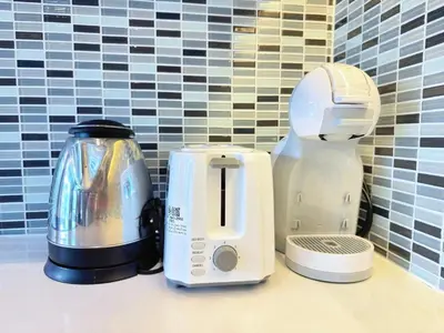 a blender and a toaster sitting on a counter at Modern Urban Living Kamala in Kamala Beach
