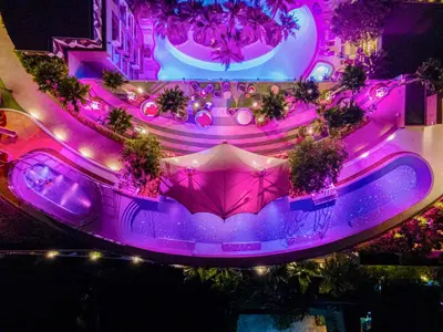 an overhead view of a fountain with purple lights at The Marin Phuket Kamala Beach in Kamala Beach