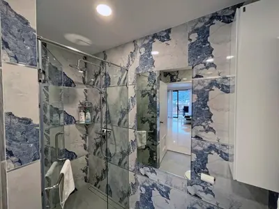 a bathroom with a shower with a glass door at Bliss Patong - 2Br Sea View Condo - Roof Top Pool in Patong Beach