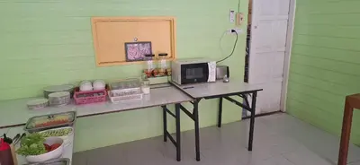 a table with a computer on it in a room at Favorite Place in Kata Beach