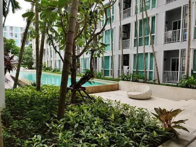 a resort with a swimming pool and a building at 5 Floor - The Base Downtown Condominium next to Central Shopping Mall in Phuket Town