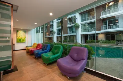a row of colorful chairs in a building at iCheck inn Residences Patong in Patong Beach