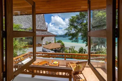 a view of the ocean from the balcony of a villa at Aoyon Beach, a 5-bedroom Thai-style villa with stunning sea views, 50 meters direct beach access, free maid, in Phuket Town