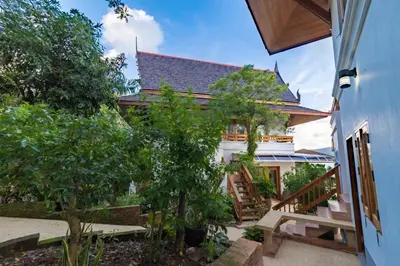 a view of the house from the courtyard at Aoyon Beach, a 5-bedroom Thai-style villa with stunning sea views, 50 meters direct beach access, free maid, in Phuket Town