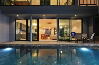 an external view of a house with a swimming pool at 3bdr Granary Pool Villa Bangtao Beach by CapitalPro GRN-A4 in Phuket Town