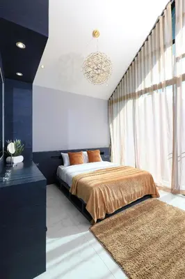 a bedroom with a bed and a large window at 3bdr Granary Pool Villa Bangtao Beach by CapitalPro GRN-A4 in Phuket Town