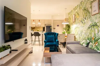 a living room with a couch and a table at Cassia 2 BR Sea View&Terrace apt by NLA in Bang Tao Beach
