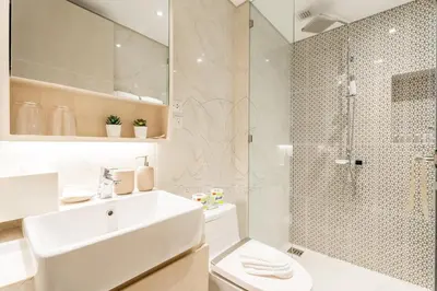 a white bathroom with a sink and a shower at Cassia 2 BR Sea View&Terrace apt by NLA in Bang Tao Beach