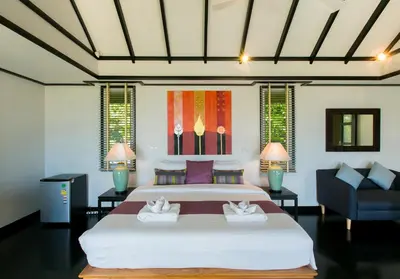 a bedroom with a large bed and a couch at Katamanda Villa Mila A1 near Kata Beach in Kata Beach