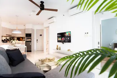 a living room with a couch and a table at Cassia 1 BR Lake&Pool View apt by NLA in Bang Tao Beach