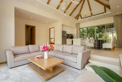 a living room with a couch and a table at 3-Bedroom Pool Villa in Trichada Bangtao in Bang Tao Beach