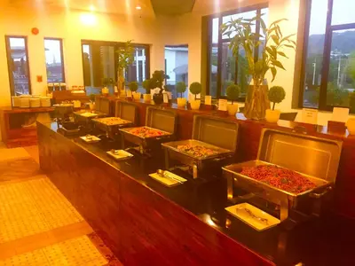 a buffet line with plates of food in a restaurant at Chalong Miracle Lakeview in Chalong