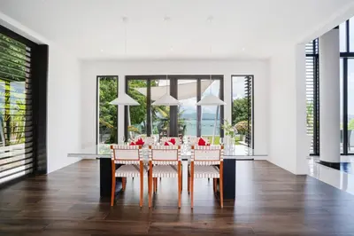 a dining room with a table and chairs at Full Seaview 5BR Villa Serenity, Elite Living at Cape Yamu in Ban Bang La