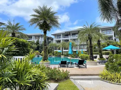a view of the resort from the pool at Naithon beachfront apartment-pool gym restaurant in Nai Thon Beach