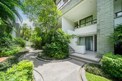 an external view of a building with a garden at Naithon beachfront apartment-pool gym restaurant in Nai Thon Beach