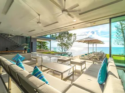 a living room with couches and a view of the ocean at Villa Amanzi Kamala by Elite Havens in Kamala Beach