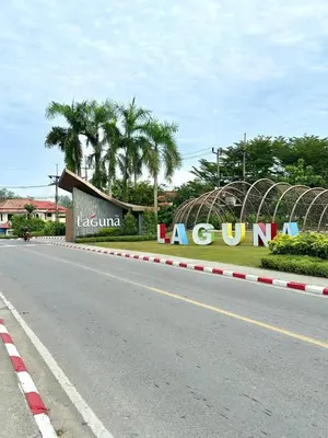 a road with a large sign on the side of the road at Golf View, Allamanda 3 Apartment in Ban Mut Dok Khao