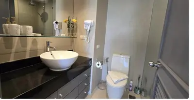 a bathroom with a sink and a toilet at Golf View, Allamanda 3 Apartment in Ban Mut Dok Khao