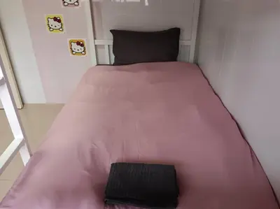 a large pink bed in a small room at Naka Tangerine Holiday Home by Bcare in Ban Rangeng