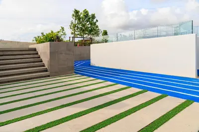 a building with blue and green stripes on the ground at Laguna SkyPark new brand apartments in Phuket Town